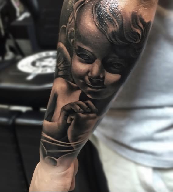 Wonderful Black Ink Cute Praying Little Cherub Tattoo On Arm