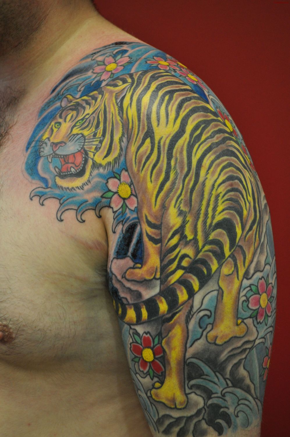 Yellow Ink Tiger Tattoo On Shoulder & Half Sleeve