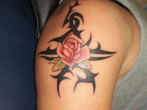 Amazing Tribal Pink Rose Tattoo On Shoulder