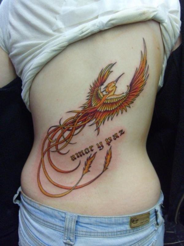 Beautiful Colored Flying Phoenix Tattoo On Back