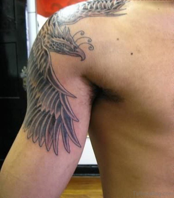 Black Flying Phoenix Tattoo On Man Shoulder