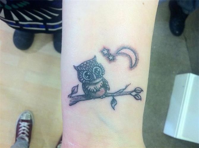 Black Ink Baby Owl Sitting In Tree Branch With Stars & Moon On Forearm