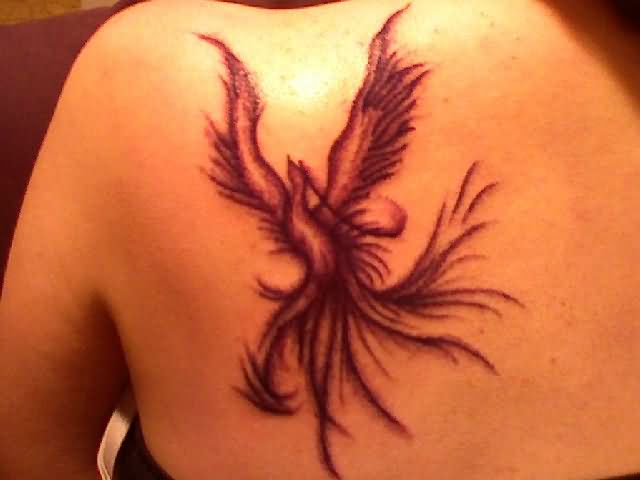 Black Ink Flying Phoenix Tattoo On Girl Back Shoulder