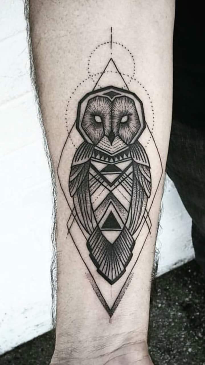 Black Ink Geometric Designed Barn Owl Tattoo On Forearm