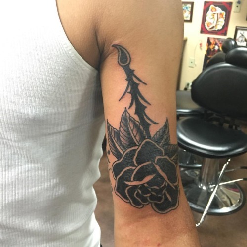 Black Ink Rose Tattoo On Male Bicep