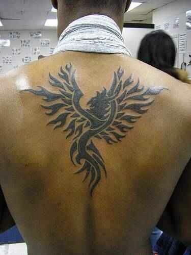 Black Tribal Flying Phoenix Tattoo On Back