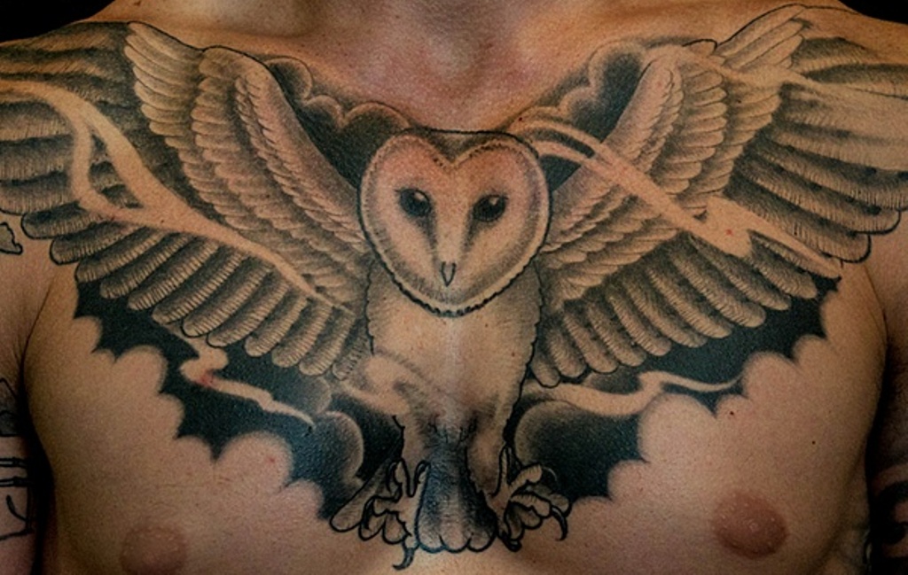 Black & White Flying Barn Owl Tattoo On Man Chest