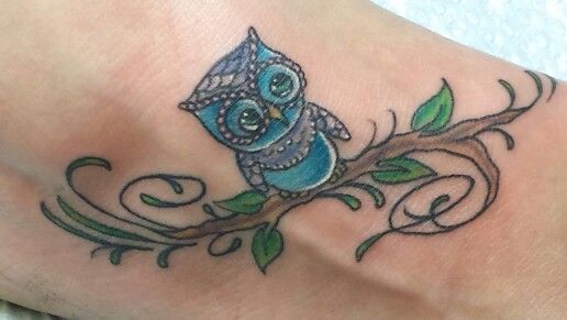 Blue Colored Baby Owl On Tree Branch Tattoo On Foot