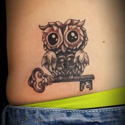 Brown Ink Baby Owl With Lock & Key Tattoo On Hip