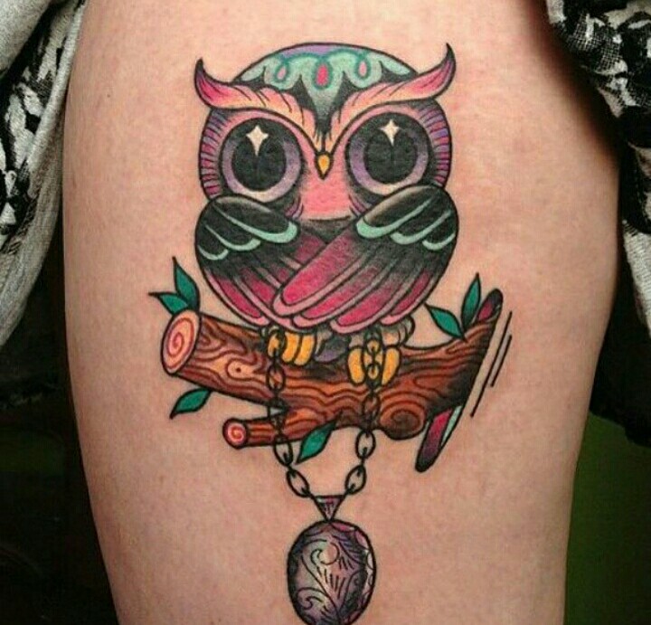 Colored Animated Baby Owl Sitting On Branch With Locket Tattoo On Thigh For Girls