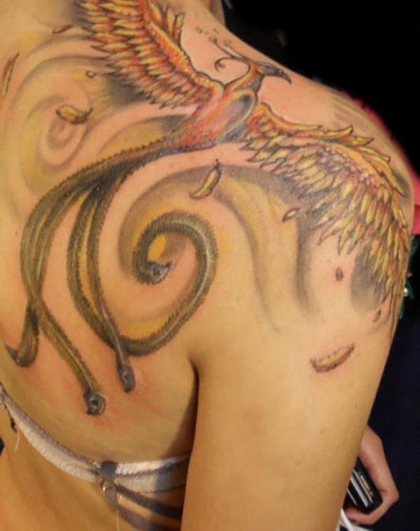 Colorful Flying Mythical Phoenix Bird Tattoo On Girl Shoulder