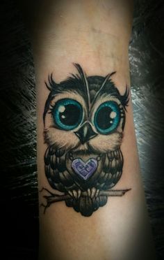 Cute Blue Eyed Baby Owl With Purple Heart Pendant Tattoo On Forearm