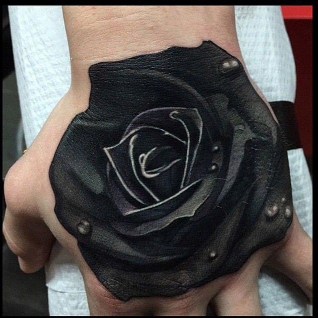 Dark Black Rose With Dew Tattoo On Hand