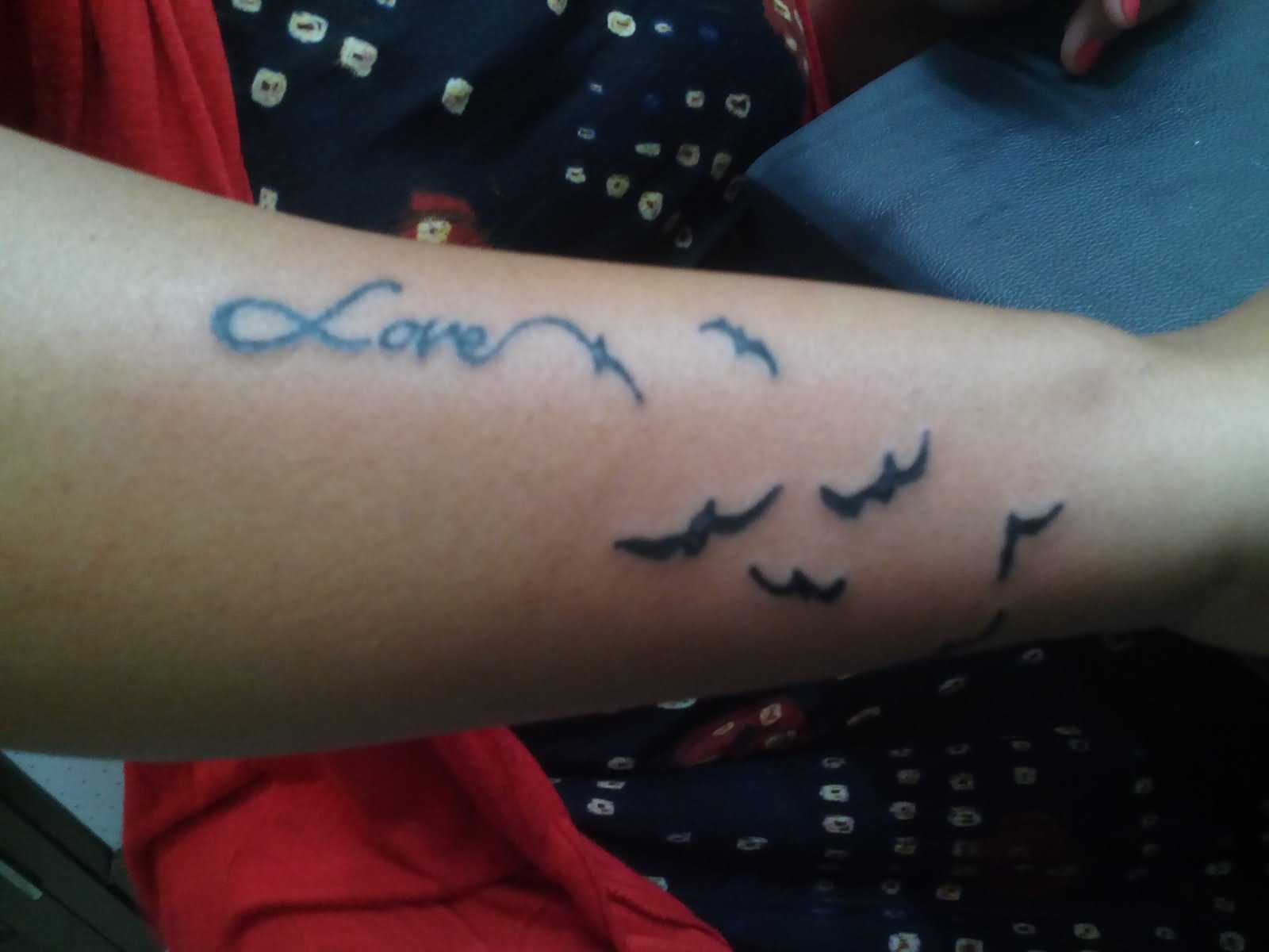 Black Love Tattoo With Small Flying Birds On Forearm