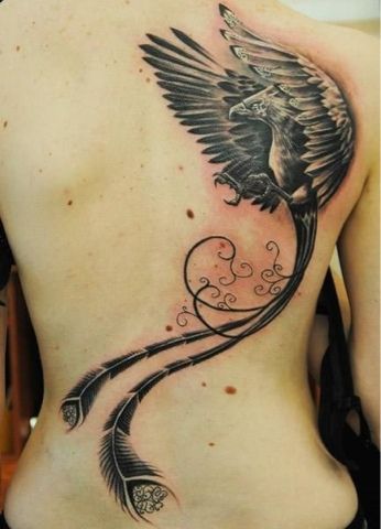 Incredible Black Ink Flying Phoenix With Long Tail Tattoo On Girl Back