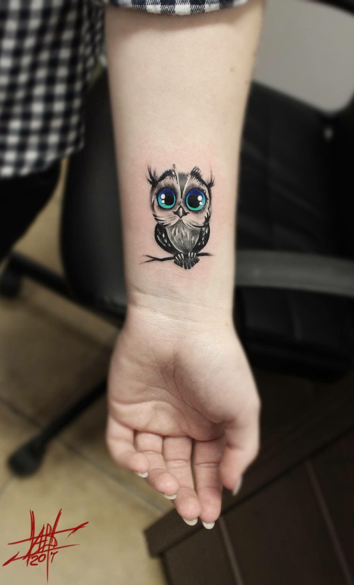 Incredible Colorful Eyed Cute Little Grey Owl Tattoo On Forearm