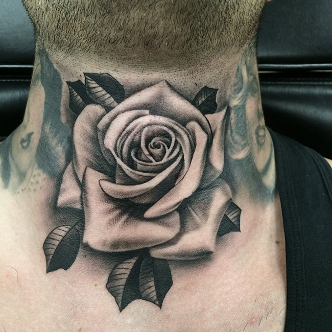 Realistic Black Rose Tattoo On Guy’s Neck