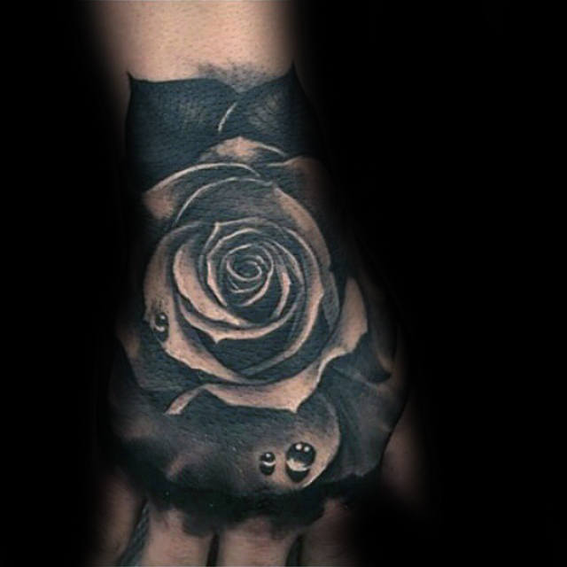 Realistic Black Rose With Dew Tattoo On Hand