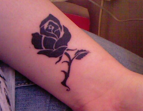 Simple Black Rose Tattoo On Lower Forearm