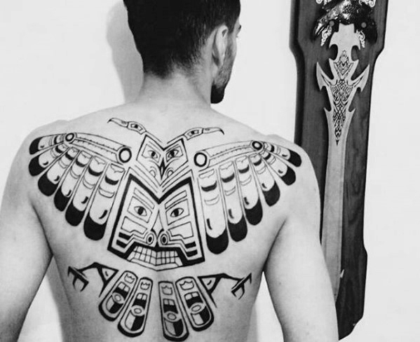 Unique Tribal Style Owl Tattoo On Man Upper Back