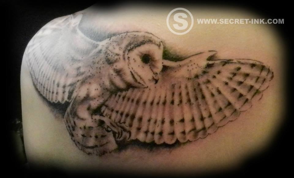 White & Grey Ink Flying Barn Owl Tattoo On Back