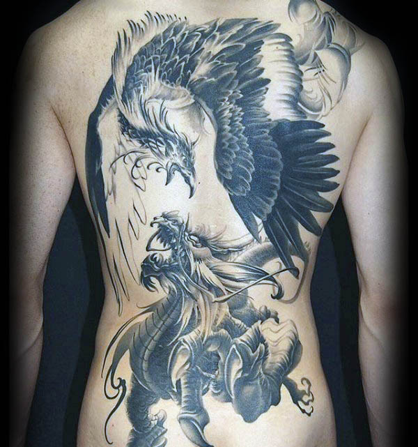 Wonderful Black Ink Realistic Dragon & Phoenix Fighting Tattoo On Full Back For Men