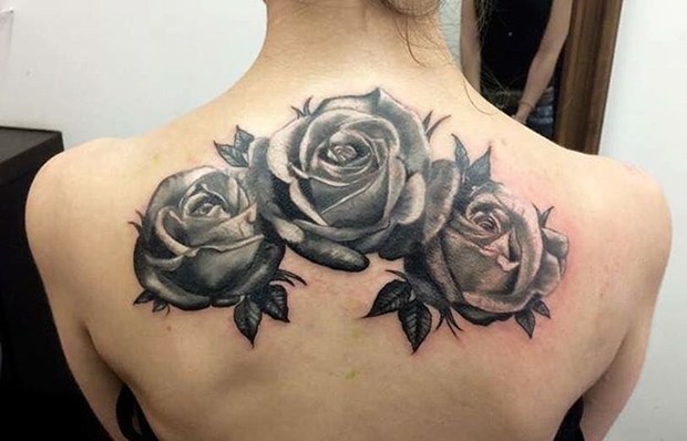 Wonderful Black Roses Tattoo Design On Girl Back