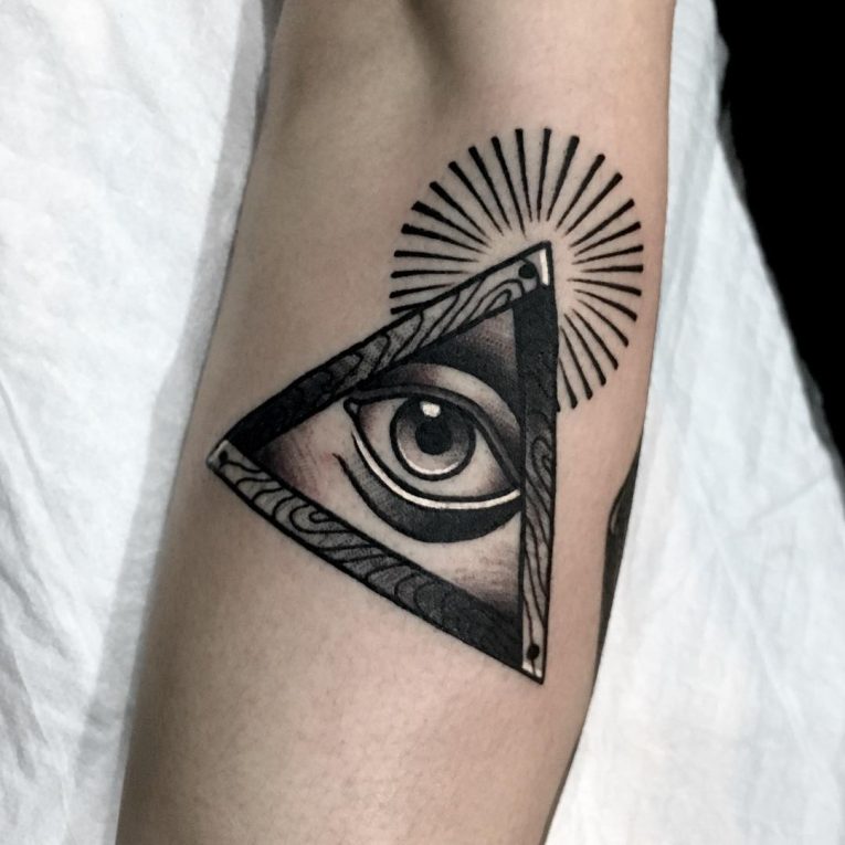 Adorable Black Ink Illuminati Tattoo On Forearm