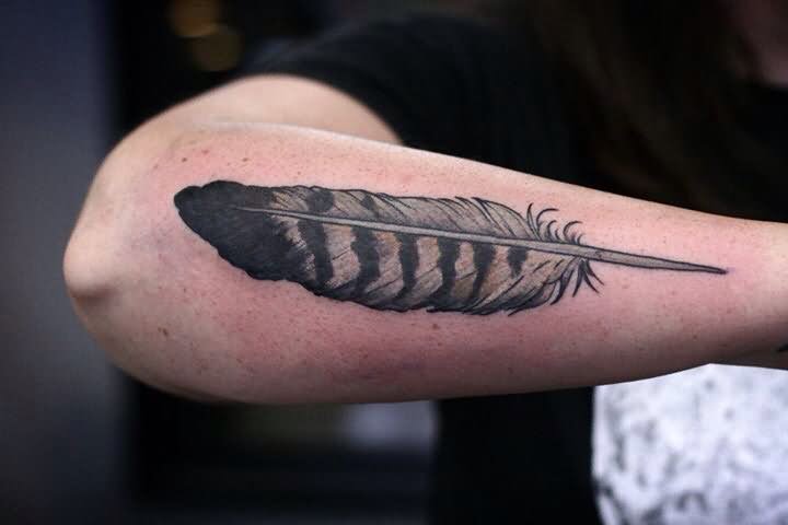 Black & Grey Ink Owl feather Tattoo On Outer Forearm By Alice Carrier