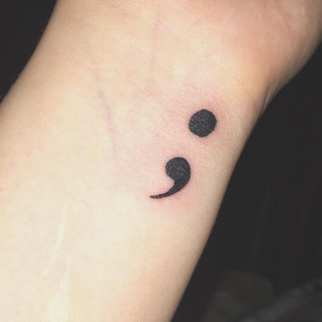 Black Ink Dark Semicolon Tattoo On Wrist