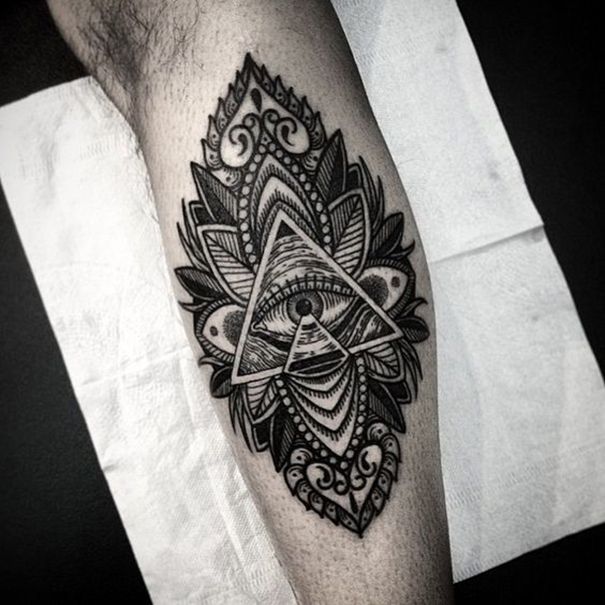 Black Ink Tribal Style Decorated Illuminati Tattoo