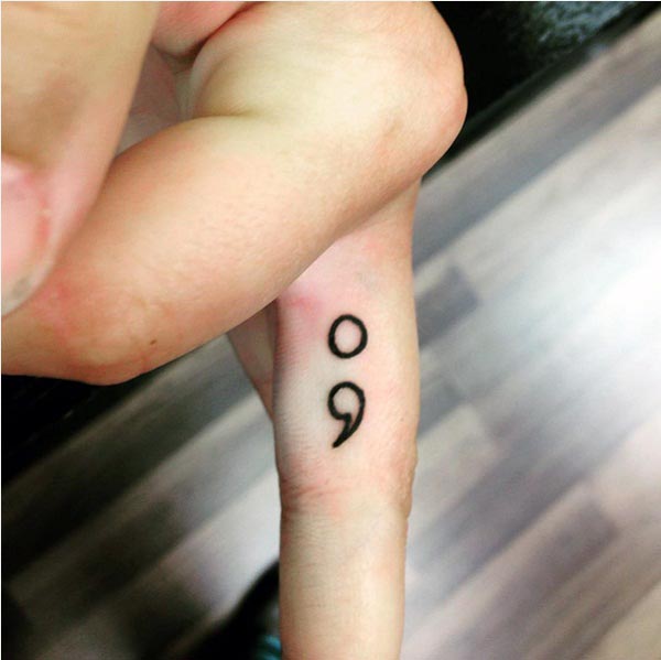 Black Outline Semicolon Tattoo On Middle Finger