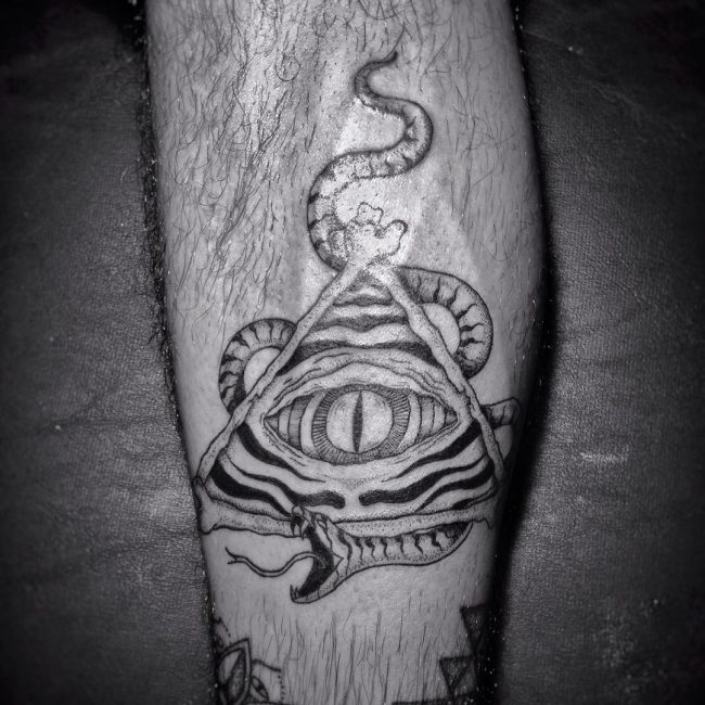 Black & White Snake & Illuminati Tattoo On Forearm