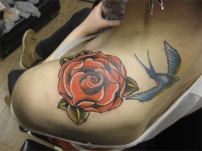 Blue Swallow and Red Rose Tattoo on Girl’s Shoulder