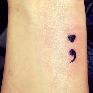 Cute Small Black Ink Semicolon Tattoo With Heart On Wrist