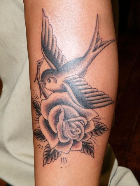 Grey Ink Rose & Swallow Tattoo On Outer Forearm