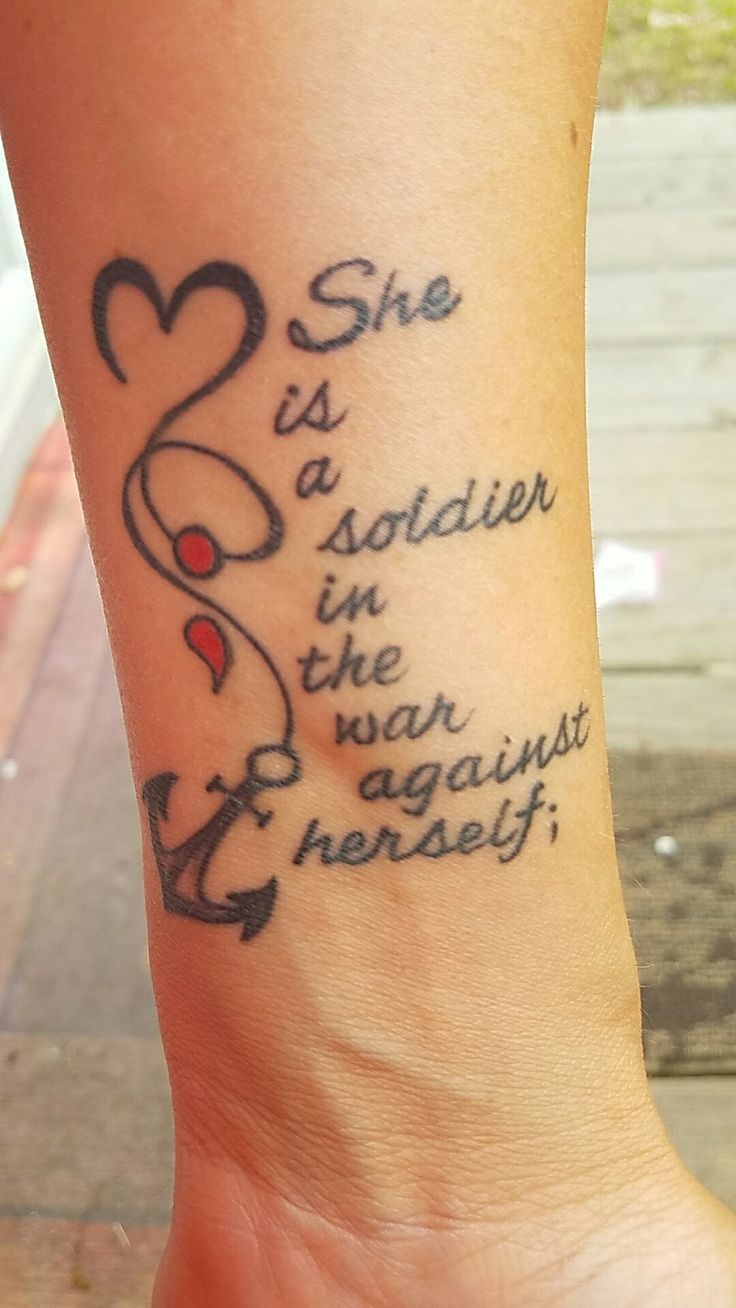 Inspirational Semicolon Tattoo On Wrist For Loved Ones With Wording ‘She is soldier in the war against herself’