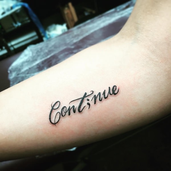 Inspirational Word ‘Continue’ With Semicolon Tattoo On Forearm To Inspire To Continue Struggle & Overcome Depression and Negative Thoughts