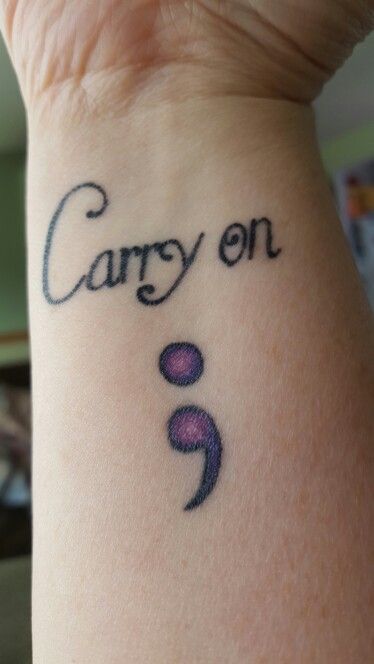 Purple Semicolon Tattoo With Wording ‘Carry on’ On Wrist