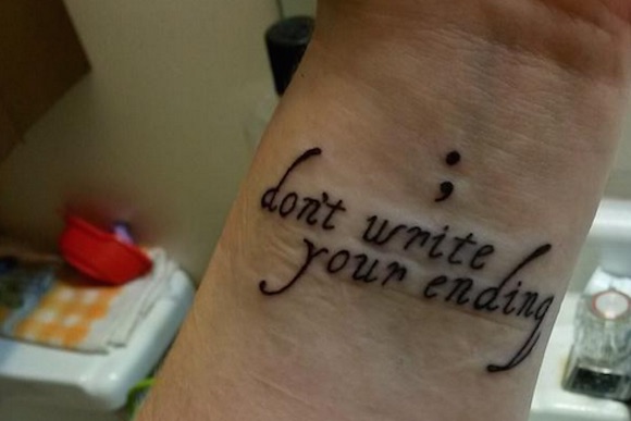 Semicolon With Wording ‘Don’t write your ending’ Tattoo On Wrist