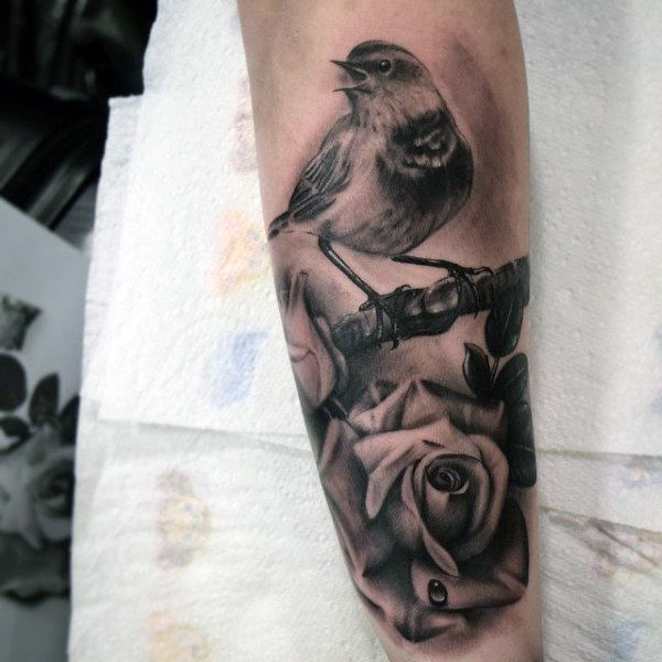 Stunning Realistic Grey Ink Sparrow On Rose Tattoo On Men Forearm
