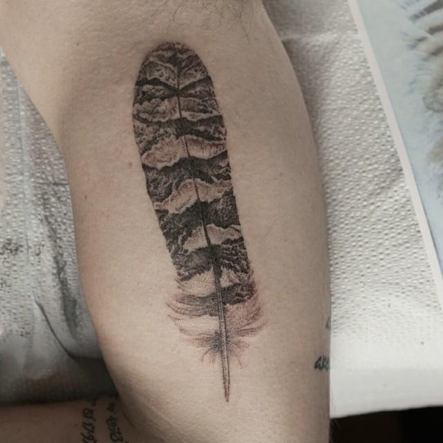Wonderful Black & White Owl Feather Tattoo On Bicep