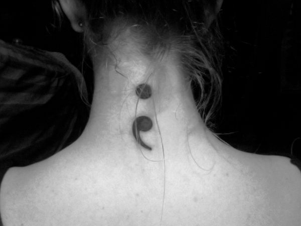 Wonderful Semicolon Tattoo On Girl Nape