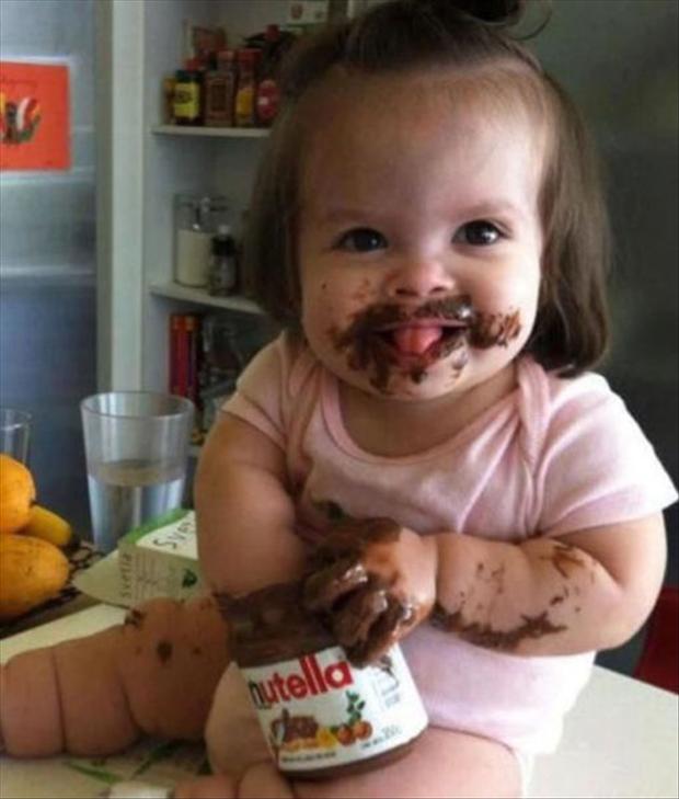 funny cute kid eating nutella
