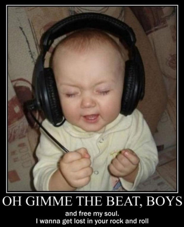 funny kid listening music on headphones