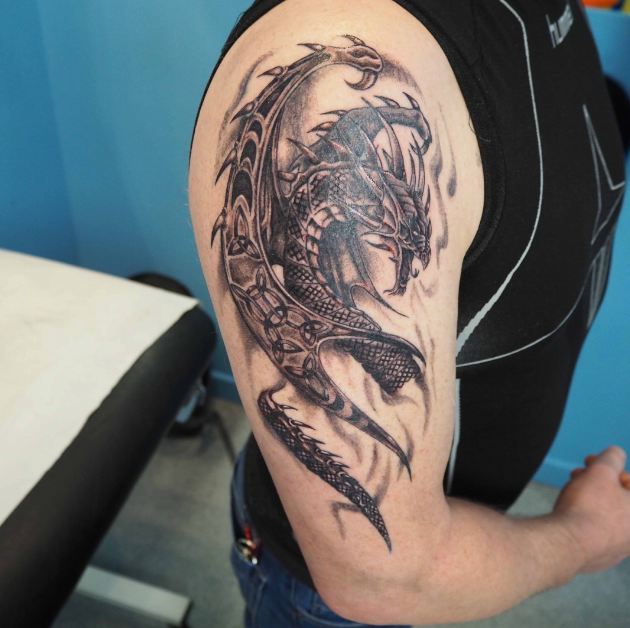 Amazing Black Ink Realistic Dragon Tattoo On Male Half Sleeve