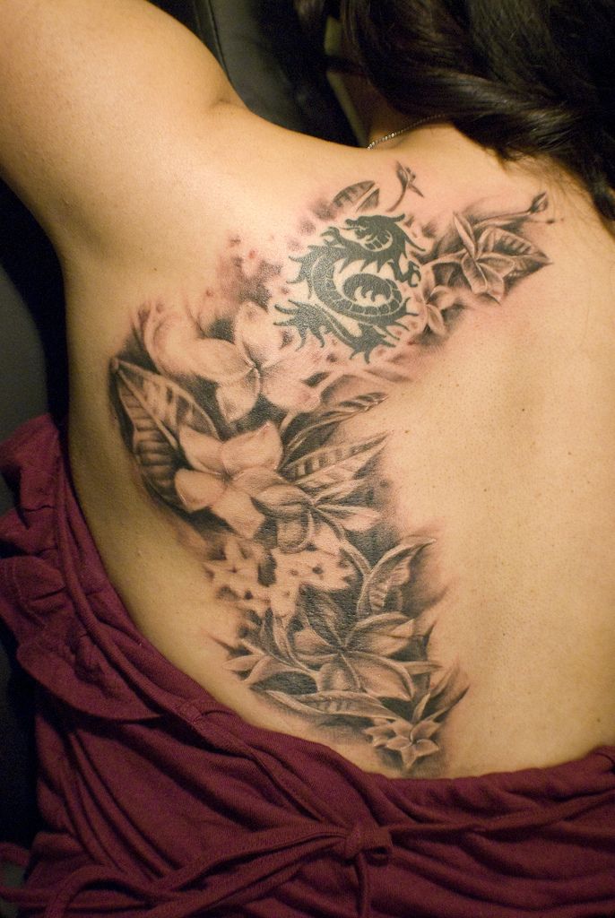 Beautiful 3D White Flowers & Black Tribal Dragon Tattoo On Girl Side Back