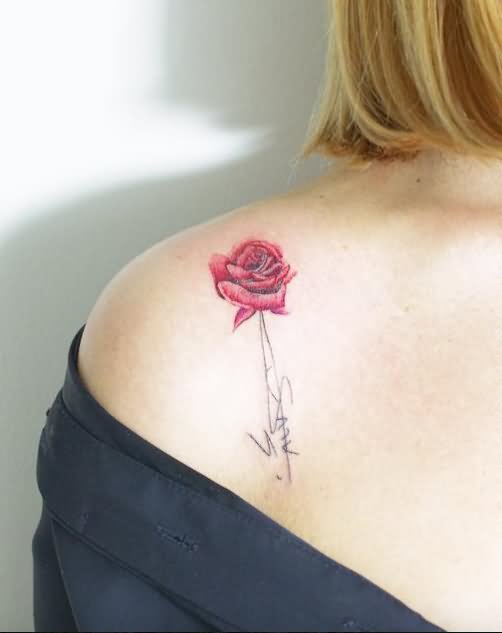 Beautiful little red rose tattoo on women shoulder