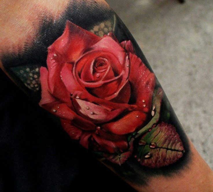 Beautiful super realistic red rose with dew tattoo
