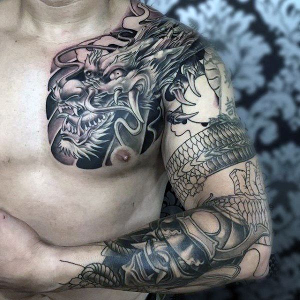 Black Ink Awesome Dragon Tattoo On Male Chest And Shoulder
